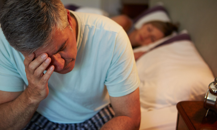 Tired man in bed